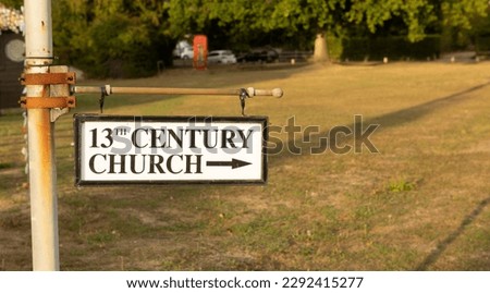 13th century church sign afternoon light
