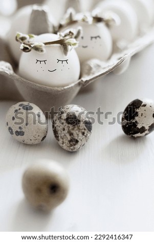 Cute easter eggs with funny smile faces in box. Happy easter concept.