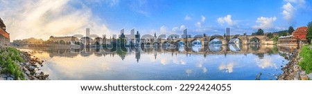 City summer landscape at sunrise - view of the Charles Bridge and the Vltava river in historical district of Prague, Czech Republic