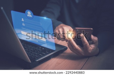 Two factor authentication or 2FA concept, Man using laptop computer for login protection and validate password with smartphone, Secure notice login verification or SMS secure verification method. Royalty-Free Stock Photo #2292440883