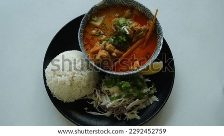 Vietnamese chicken curry in a bowl with rice.
