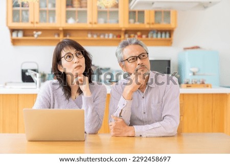 asian senior age couple using laptop, trouble Royalty-Free Stock Photo #2292458697
