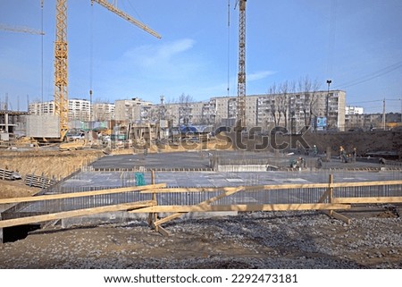Construction site of a multi-storey residential building on a spring day