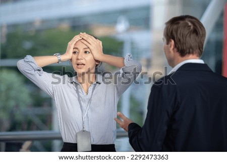 Stressed female scolding from boss. Man and woman talking controversy, Businesswoman and business man talking, arguing. Conflict problem manager and employee. Royalty-Free Stock Photo #2292473363