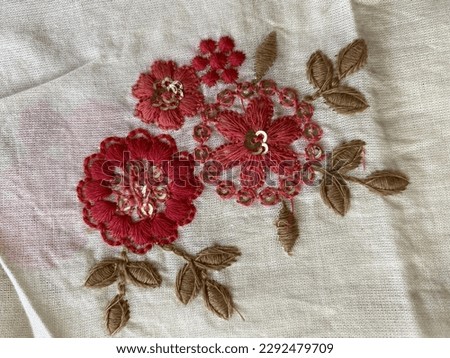 Red, peach and brown floral thread embroidered motif  with sequins