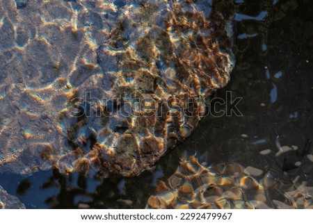 Rocks under water in the photo from above. abstract background
