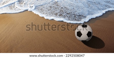 The soccer ball on the beach