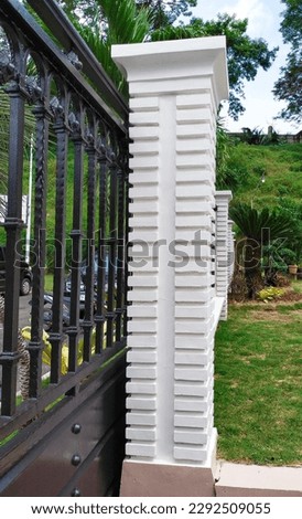 black iron fence and white fence column with minimalist style 