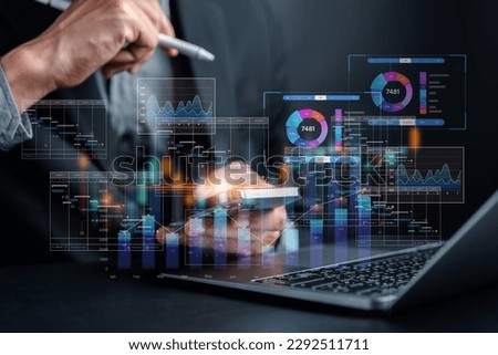 Analyst working with computer in Business Analytics and Data Management System to make report with KPI and metrics connected to database. Corporate strategy for finance, operations, sales, marketing. Royalty-Free Stock Photo #2292511711