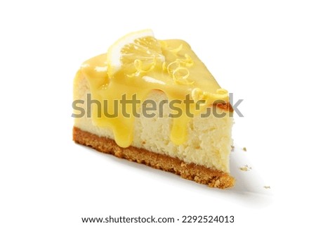 Slice of fresh baked homemade lemon cheesecake with lemon curd and lemon slices. isolated on white background Royalty-Free Stock Photo #2292524013