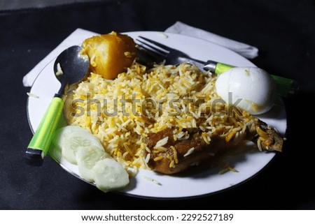 Biriyani plate nonveg in front of black background. 