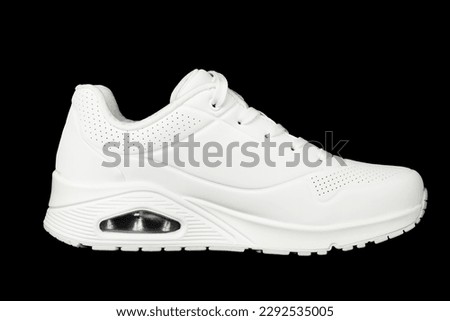 Side view of a white women's casual white sneaker.Isolate of sports shoes. Royalty-Free Stock Photo #2292535005