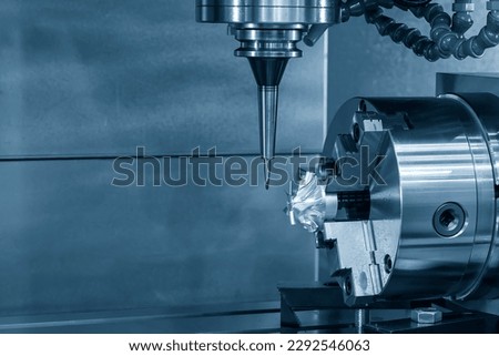 The 4-axis CNC milling machine  cutting the turbocharger part with solid ball end mill tool. The hi-technology automotive  parts manufacturing process by 5-axis machining center. Royalty-Free Stock Photo #2292546063