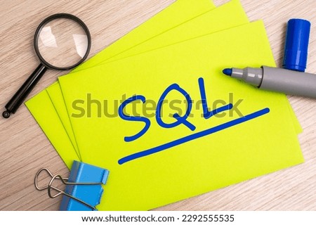 SQL - sales qualified lead - acronym text concept with marker on yellow business card