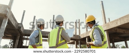Building Project with Civil Engineer, Contractor and Architect check blueprint and discussing plan details. Specialists team builder in construction site.