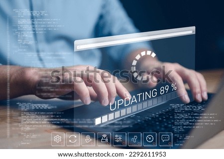Update software application and hardware upgrade technology concept, Software update or operating system upgrade, Updating progress bar on computer screen. Installing app patch. Royalty-Free Stock Photo #2292611953