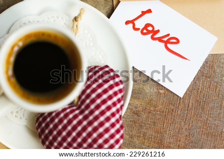 Cup of coffee, flowers, cookies and love note