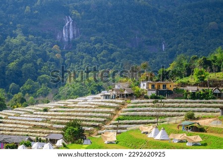beautiful landscape Doi Inthanon National Park attraction A place to rest, set up a tent, with a beautiful Siri Phum Waterfall. in the background. Royalty-Free Stock Photo #2292620925