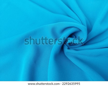 blue color chiffon fabric texture seamless with beautiful closeup detail fabric. Luxury chiffon textile pattern with soft and delicate material.