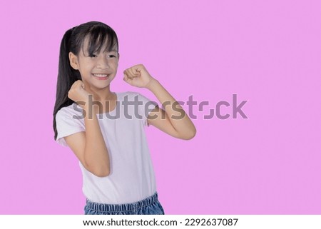 Image of Asian child posing on pink background