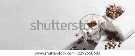 Drip Coffee Bag in a Cup, Coffee Trend, Quick Way to Brew Ground Coffee Using Paper Type Filter Royalty-Free Stock Photo #2292650683