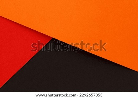 Orange, red and black color paper flat lay background