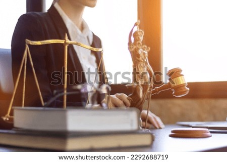 A team of lawyers is consulting and examining legal matters from law books to assist clients who come to consult legal issues regarding litigation. concept of a legal advisory team