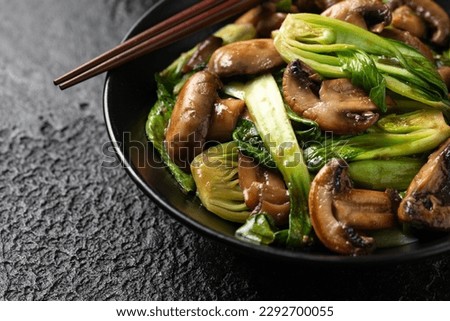 Bok Choy or Pak Choi and Mushroom Stir Fry in vegetarian sauce. Healthy vegan food. Royalty-Free Stock Photo #2292700055