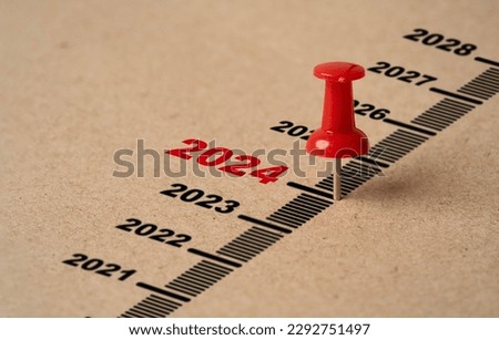 Red pin on paper with 2024 year for preparation merry Christmas and happy new year concept. Royalty-Free Stock Photo #2292751497