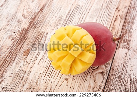 Mango fruit on wood