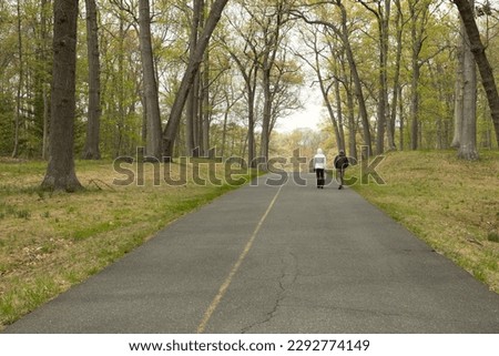 People walking in Caumsett State Historic Park Preserve Royalty-Free Stock Photo #2292774149