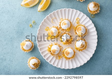 Mini lemon meringue tarts filled with lemon curd, one bite desserts idea