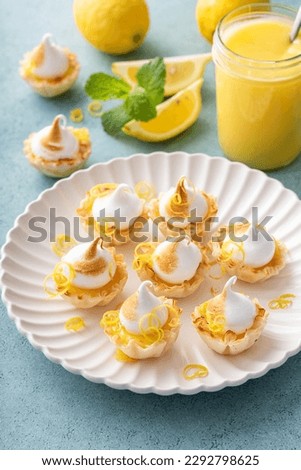 Mini lemon meringue tarts filled with lemon curd, one bite desserts idea