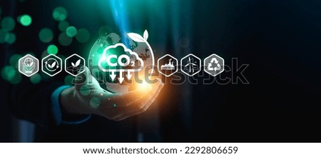 CO2 emission reduction concept, businessman with environmental technology Icons, global warming, sustainable development, renewable energy business. climate change, carbon capture, storage, reuse Royalty-Free Stock Photo #2292806659