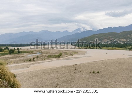 Aerial view of a flooding river in spring season 2023 in the Swat valley, Khyber Pakhtunkhwa, Pakistan