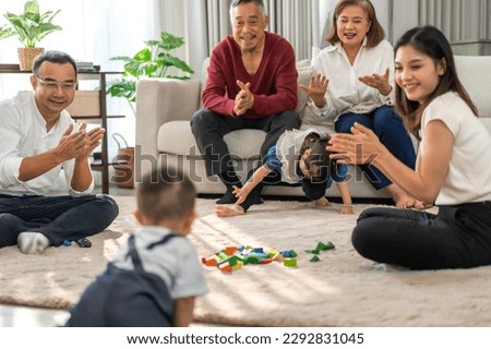 Portrait of enjoy happy love family asian mother playing and teaching help adorable little asian baby learning to crawling.Mom help first step with cute son beginnings development at home.Love family Royalty-Free Stock Photo #2292831045