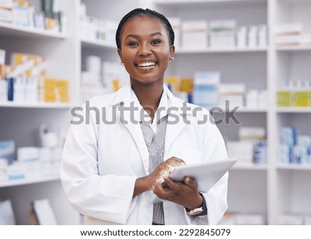 Portrait of black woman in pharmacy with tablet, smile and online inventory list for medicine on shelf. Happy female pharmacist, digital checklist and medical professional checking stock in store. Royalty-Free Stock Photo #2292845079