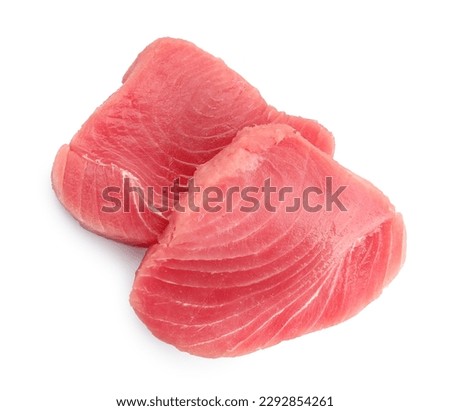 Two raw tuna fillets on white background, top view