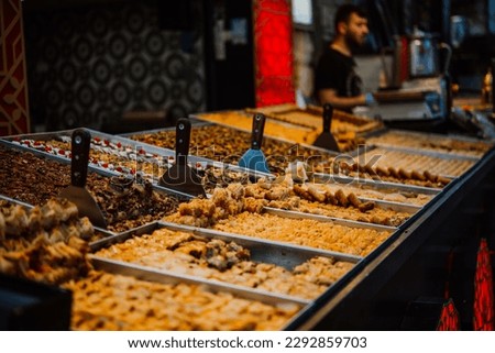 Different kinds of baklava and eastern sweets on sale at Carmel Market in Tel Aviv, Israel. Royalty-Free Stock Photo #2292859703