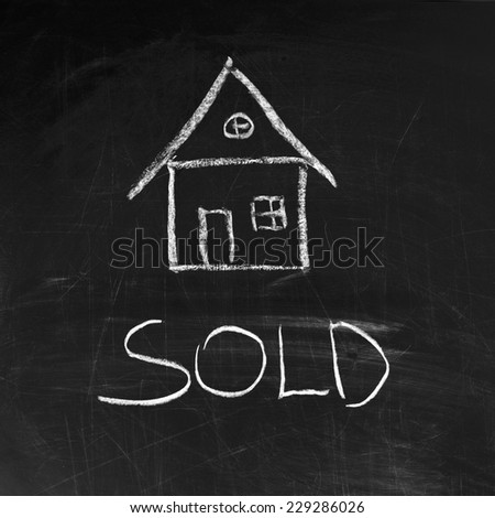 sold house written on blackboard