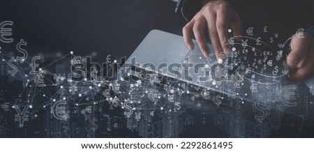 Digital banking, E-transaction, internet payment, financial technology FinTech concept. Person using mobile phone and laptop for mobile banking and online shopping, global currencies on virtual screen Royalty-Free Stock Photo #2292861495