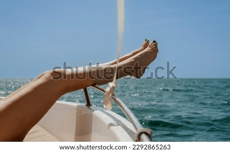 Photo of a woman's feet on a boat in the ocean