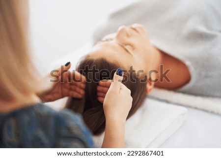 Picture of an treatment that involves gently touching 32 points on your head