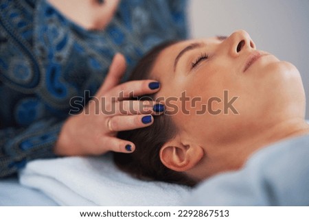 Picture of an treatment that involves gently touching 32 points on your head