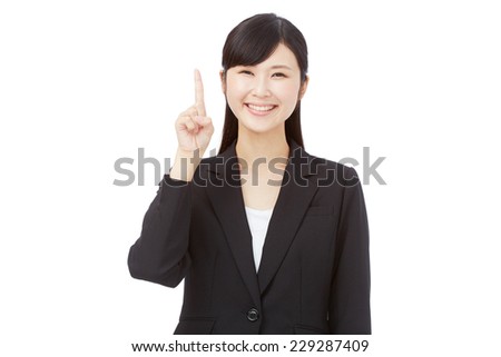 Japanese businesswoman pointing up