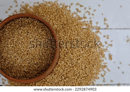 Wheat grain, wheat in a clay place on a white table, background image for presentations, photo, day, holy evening, holiday, harvest, food, bread, wallpaper, rich