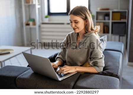 Success woman freelancer is working on a new project on laptop. Work business people concept. Royalty-Free Stock Photo #2292880297