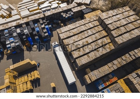 drone shot of stock of wooden euro pallets, outdoor pallet storage area. High quality photo