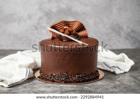 Chocolate cream cake. Chocolate birthday cake on dark background. patisserie desserts Royalty-Free Stock Photo #2292884941