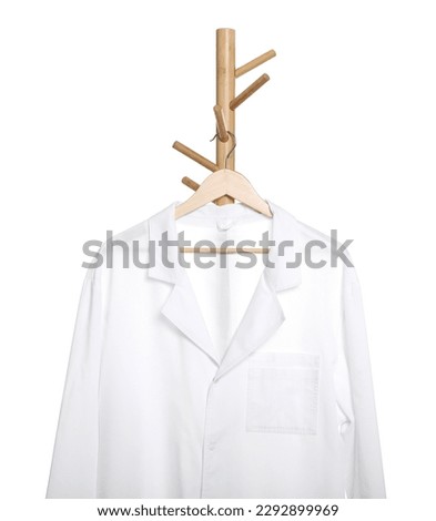 Doctor's gown on rack against white background. Medical uniform Royalty-Free Stock Photo #2292899969